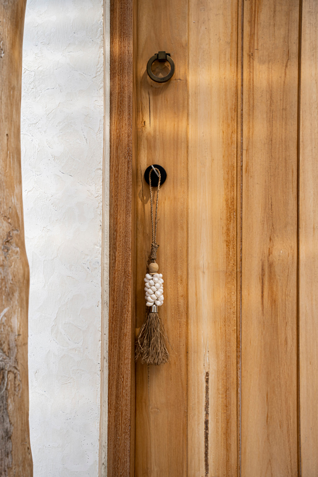 The White Shell and Raffia Tassel
