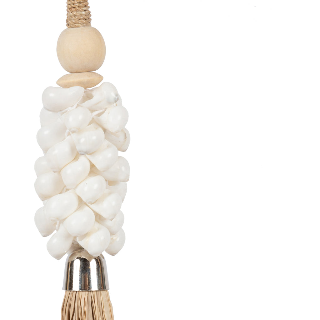 The White Shell and Raffia Tassel